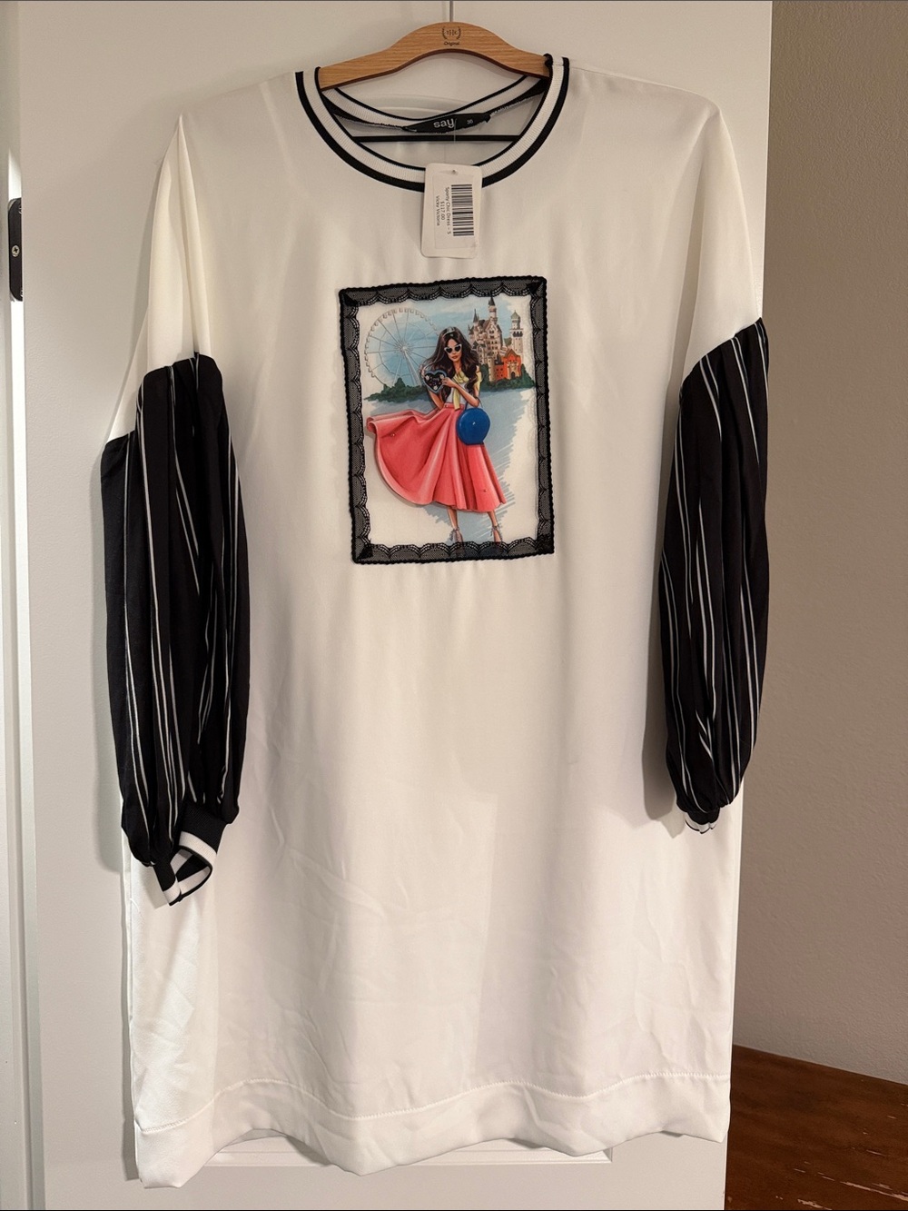 Trendy boutique White Dress with Black Striped Sleeves and Pink Graphic